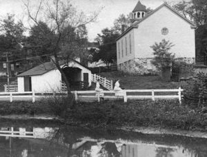 Mill race and weigh station with John Wesley Church in the background